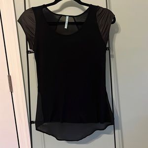 Black light weight top. Faux leather cap sleeves and sheer back